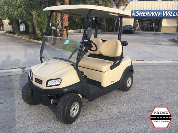Tan Club Car 2 Passenger Golf Cart